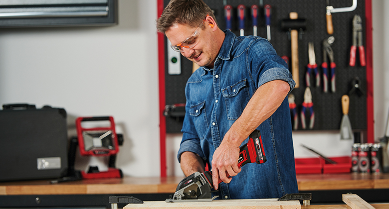 Person using mini circular saw